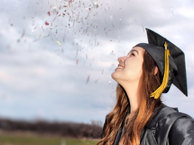Senior girl; seniors; woman; natural light; north tx photographer; pives digital photography; outdoors; confetti; graduation; black cap and gown